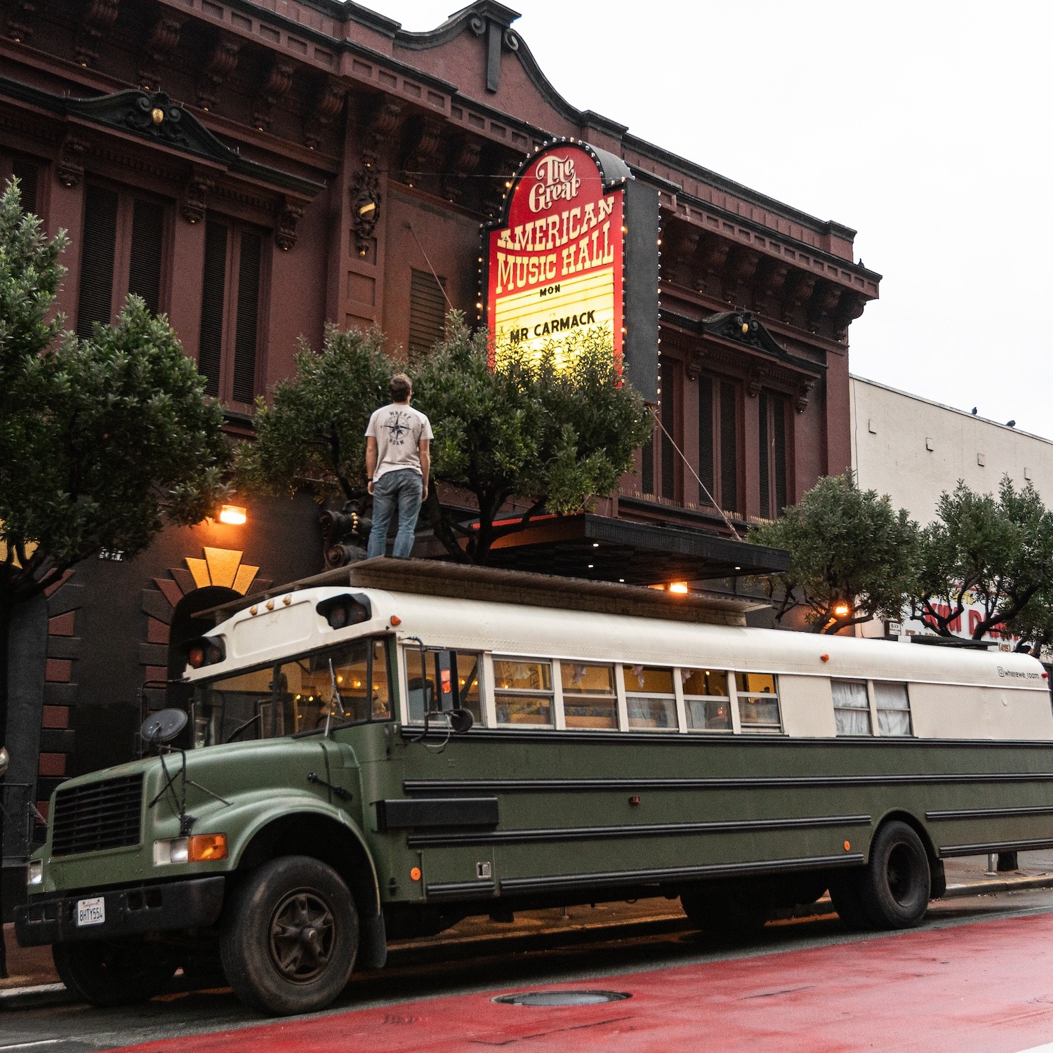 Standing on the school bus at a concert venue